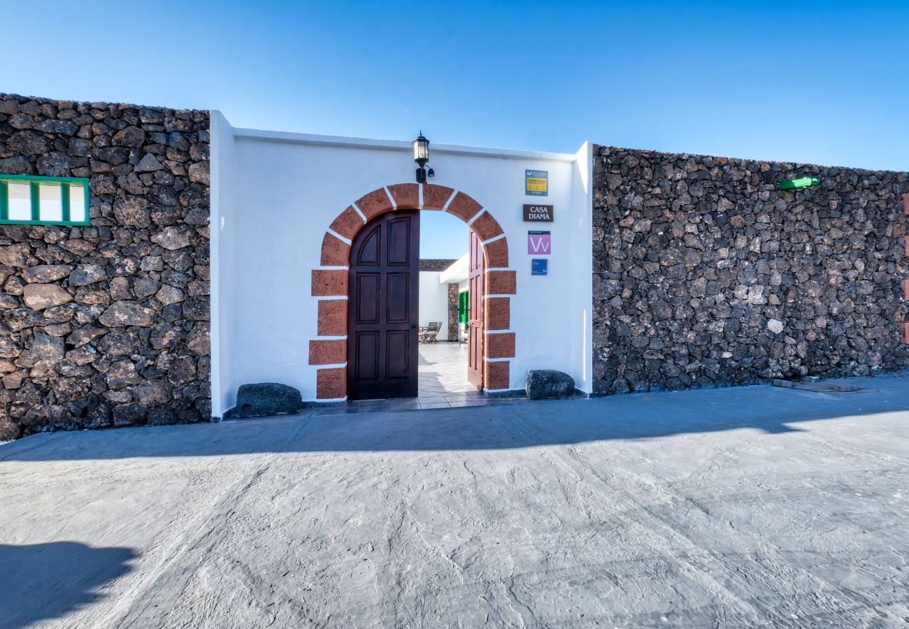 House in Yaiza - Casa Diama 2: view of La Geria and shared pool  House in Yaiza - Casa Diama 2: view of La Geria and shared pool